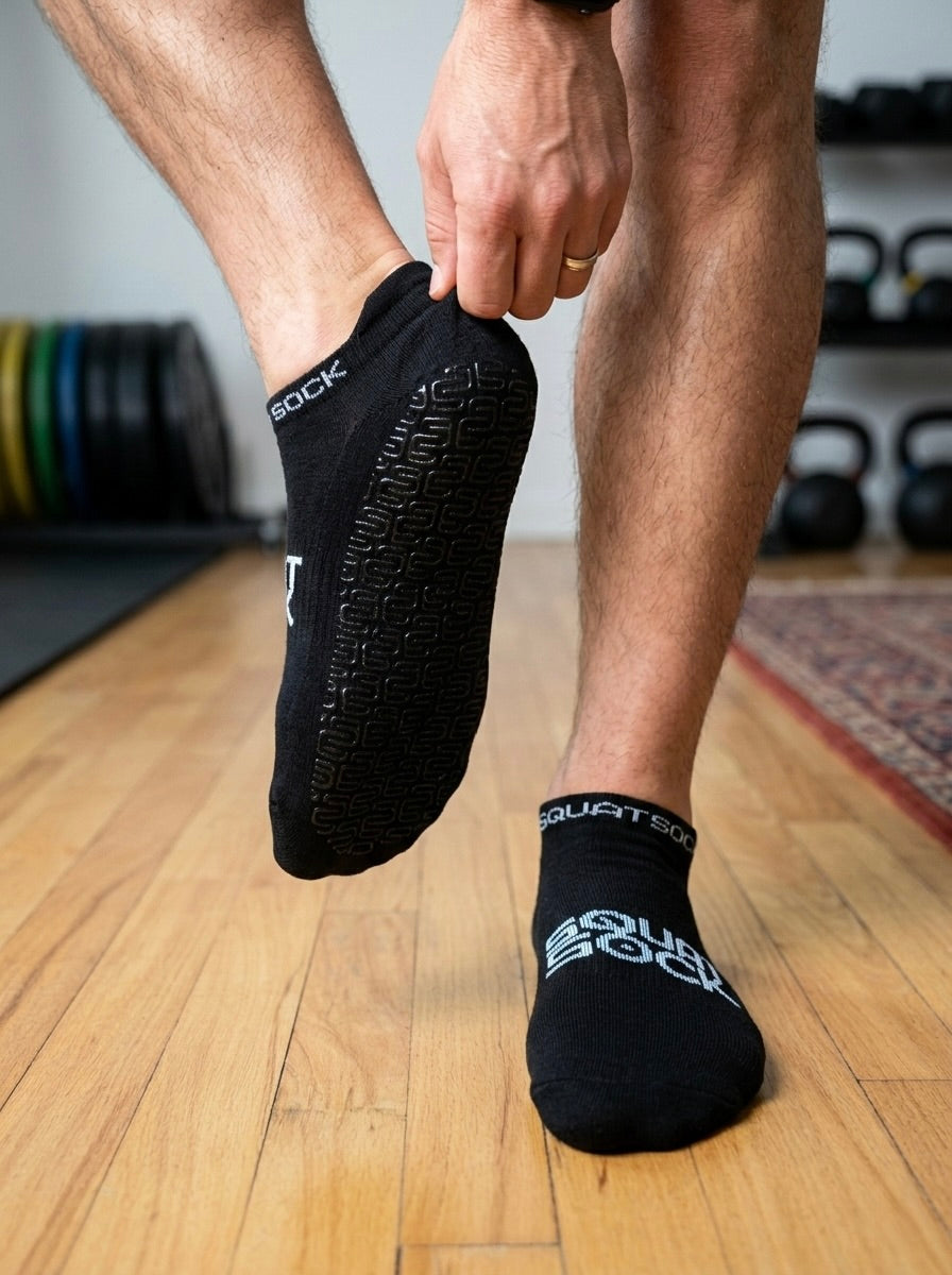 The SquatSock® has gripped bottoms for gym or home use.